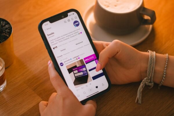 Person scrolling social media on phone