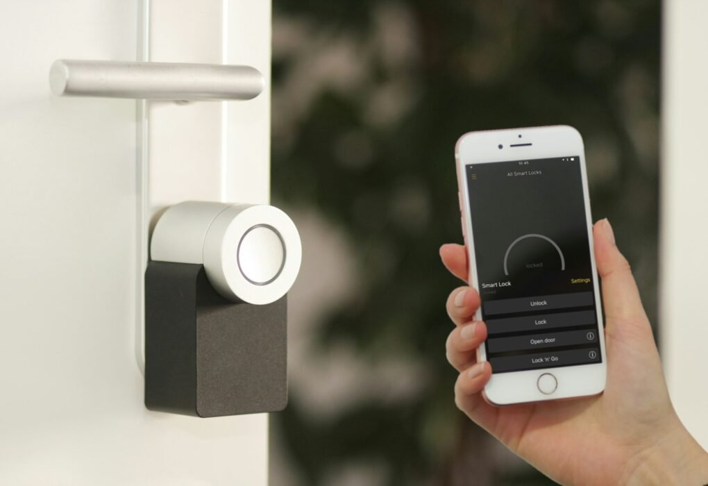 Person using a phone app to control a smart home lock