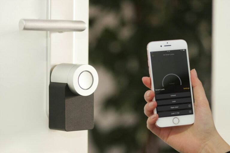 Person using a phone app to control a smart home lock