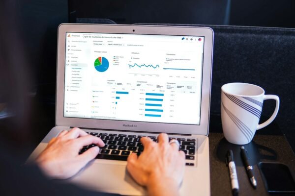 Person using laptop for subscription business analysis